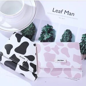 NWOT- Cow pattern wallet/ card holder. Pink cow/ black cow